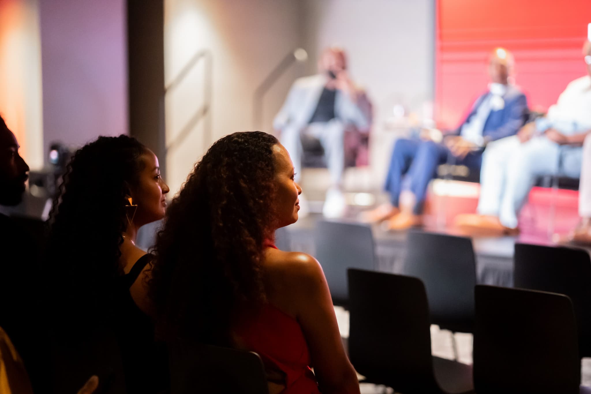 Members watching a talk in the event space at Atlanta HQ